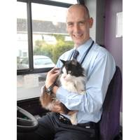 Joyrider: Casper the cat with bus driver Rob Stonehouse, on his bus, in Plymouth. 